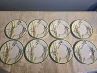 Top view of eight Iris saucers arranged on table