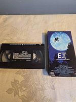 Front view showing Aladdin tape and E.T. tape with sleeve