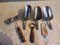 Front view of all six tools lined up to show variety and condition