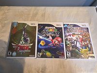Front view of three Wii game cases