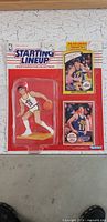 Front of sealed John Stockton Starting Lineup figure with two cards