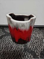 Front view showing red, white and brown drip-glaze and overall shape