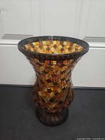 Side view of glass mosaic vase showing overall shape and pattern