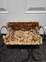 Interior top view showing weave, fraying and both metal ring handles