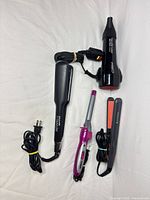 Overview of four corded AC hair styling tools