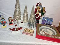 Overall view showing Santa, cone trees, nutcrackers, church, glasses, clock, lights, perfume