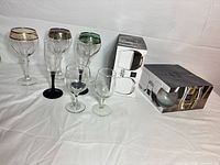 Group shot showing all loose glasses and boxed pair