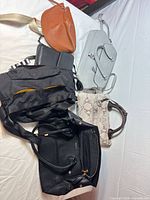 Group shot of all six bags on white surface