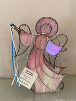 Full front view of stained glass Sariel angel figurine showing colors, shape and ribbons