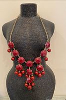 Full view of necklace on bust form showing bib design