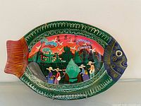 Front view of hand-painted fish plate showing full artwork and colours