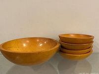 Large serving bowl alongside stacked smaller bowls