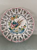Front view showing full plate design and reticulated rim