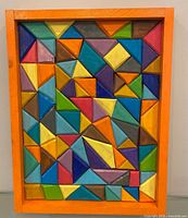 Front view of painted geometric wooden tray