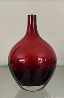 Front view of ruby red IKEA Salong vase