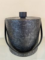 Front view of Irvinware ice bucket showing pattern, lid, and handle