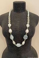Necklace on display bust showing overall design and bead arrangement