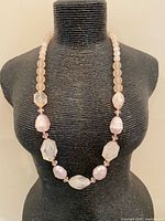 Front view of necklace on display bust showing bead arrangement