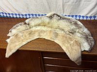 Two collars stacked showing fur texture and lining