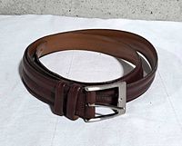Coiled brown leather belt full view