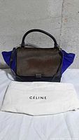 Front view of Celine Trapeze bag with dust bag