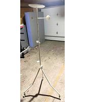 Full view of white valet stand showing tray, hooks and casters