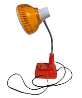 Side view of complete lamp showing amber shade, chrome gooseneck, red base and cord