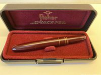 Open case showing Fisher Space Pen and interior lining