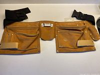 Front view showing full dual-pouch suede tool belt with black nylon belt