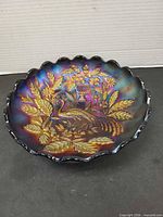 Top view showing full bowl, scalloped rim, iridescent finish