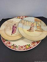 Group shot showing two Shakespeare plates stacked on 15-inch fruit border platter