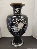 Full view of black lacquer vase with inlay