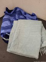 Both scarves folded together