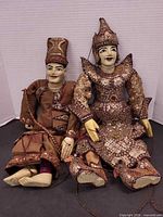 Two Burmese yok-thei marionette puppets side by side