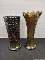 Both carnival glass vases side by side showing size and patterns