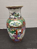 Front view showing figural panel and decoration