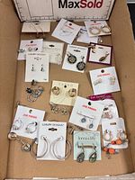 Full box view showing all earring pairs on cards