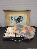 Open case showing booklet, chip tub and part of tile trays