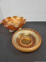 Overview of both marigold carnival glass bowls