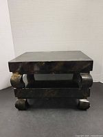 Front view of one pedestal showing shape and finish