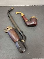 Both German pipes side by side showing relative sizes and overall condition