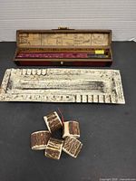 Open lacquered case, ceramic ashtray, napkin rings group