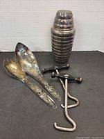 Overview of all items: cocktail shaker, salad servers, boot pull ups