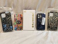 All five phone cases laid out front view