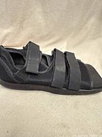 Left side view showing mesh upper and three Velcro straps