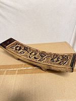 Single incense burner showing carved floral design and feet