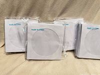 Front view of four sealed packs showing clear windows and Made in China text