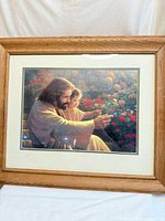Full view of framed print showing Jesus with child, oak frame visible