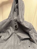 Front view showing hood, zipper and upper body