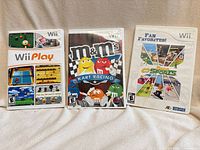 Front view of all three Wii game cases